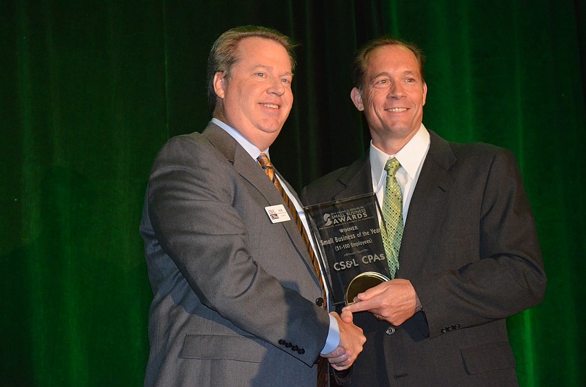 Pat Dorsey presents the Small Business of the Year (51 to 100 Employees) Award to Bob Stanell of CS&L CPAs.