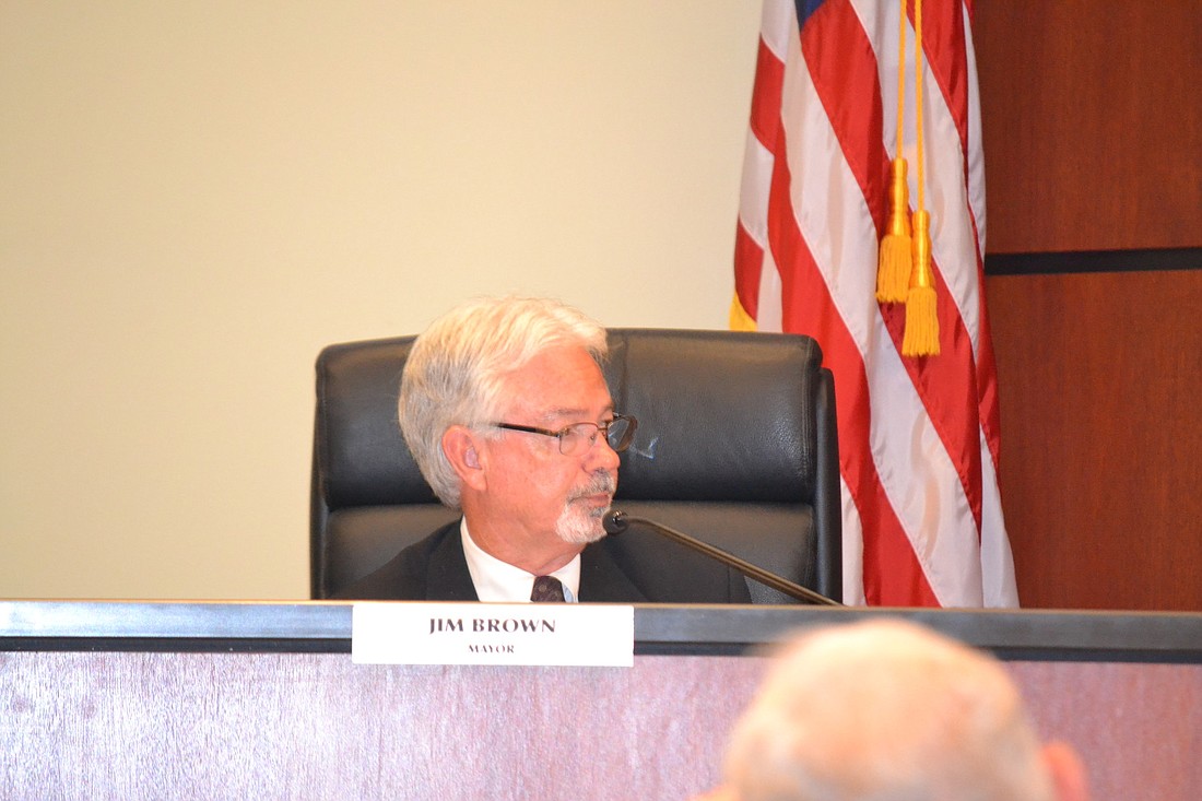 Mayor Jim Brown called for a show of hands Monday that led to another decision not to move forward with discussions about burying the Key's power poles.