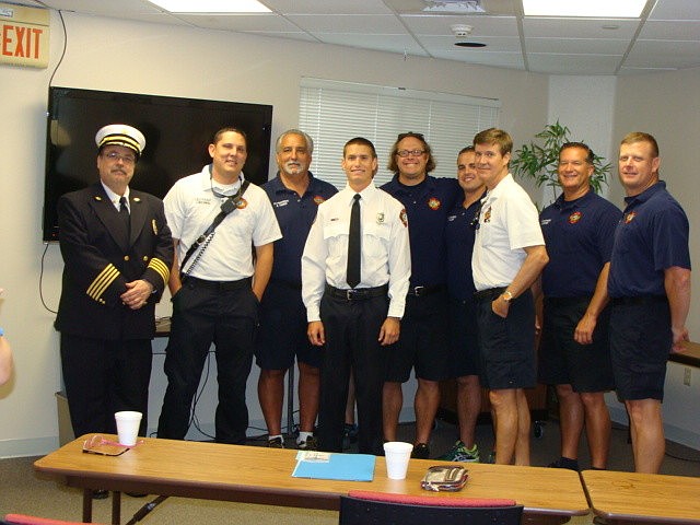 Brandon Berwick, center, with his B-shift crew members
