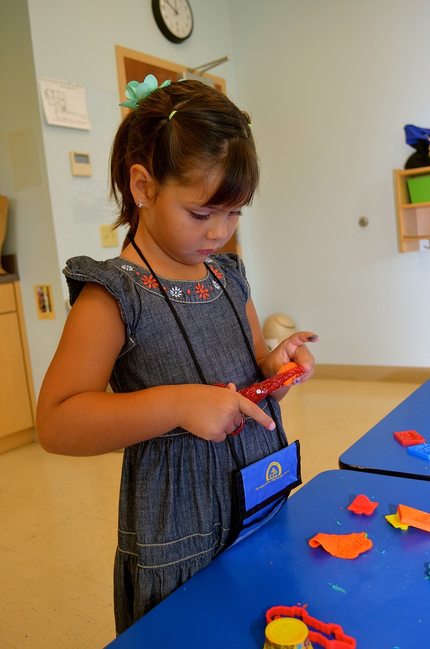 Emma Guerra plays with Play-Doh.