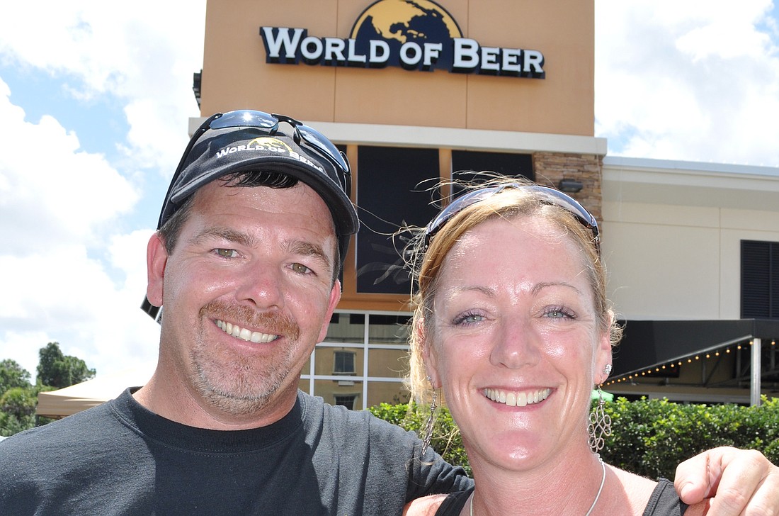 World of Beer co-owners Dean and Jen Lambert outside of the bar's University Parkway location.