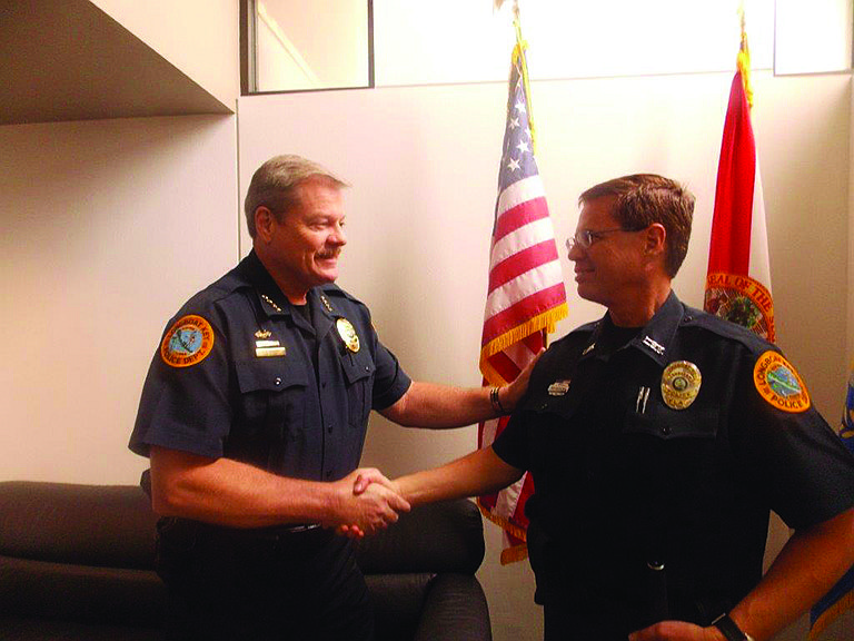 Courtesy photo Longboat Key Police Chief Pete Cumming welcomes new Reserve Officer Ed Kolodzieski to the force earlier this month.