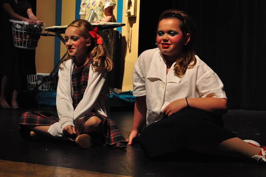 Mary Grace Epps (as Penny Pingleton) and Jordan Bollinger (as Tracy Turnblad) watch their favorite show on television.