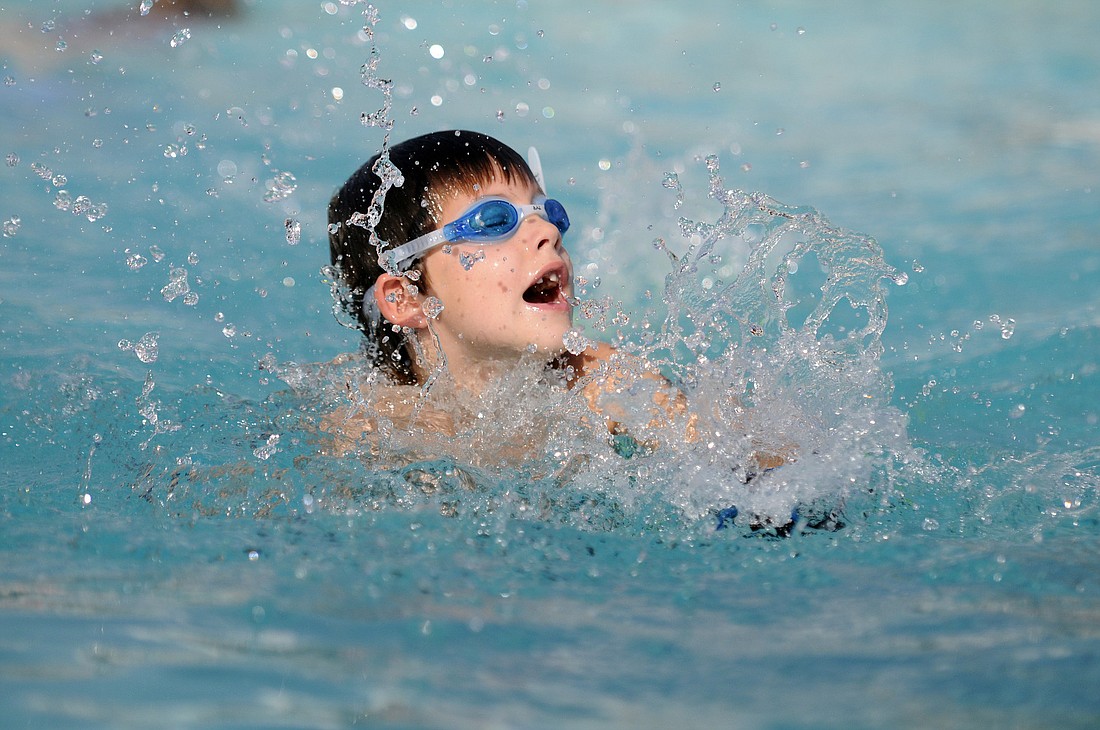 Photos by Jen Blanco Seven-year-old Ian Keck couldnÃ¢â‚¬â„¢t wait to jump into the pool and practice his strokes.