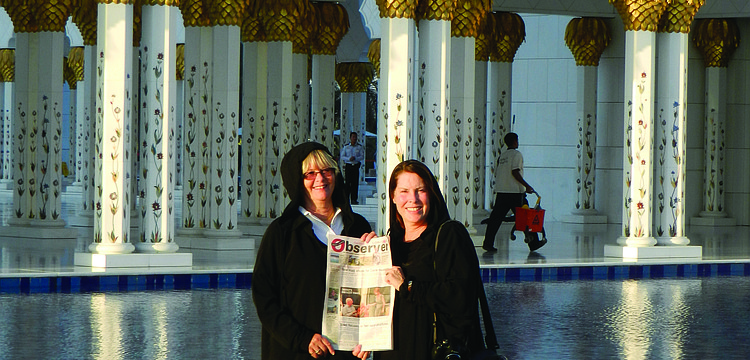 MIGHTY MOSQUE. Christina Filkins and Tory Newman catch up on their Longboat Observer news in front of the Sheikh Zayed Grand Mosque in Abu Dhabi, United Arab Emirates.