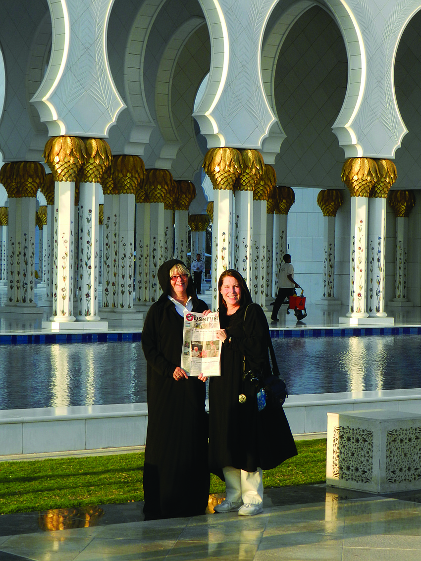 MIGHTY MOSQUE. Christina Filkins and Tory Newman catch up on their Longboat Observer news in front of the Sheikh Zayed Grand Mosque in Abu Dhabi, United Arab Emirates.