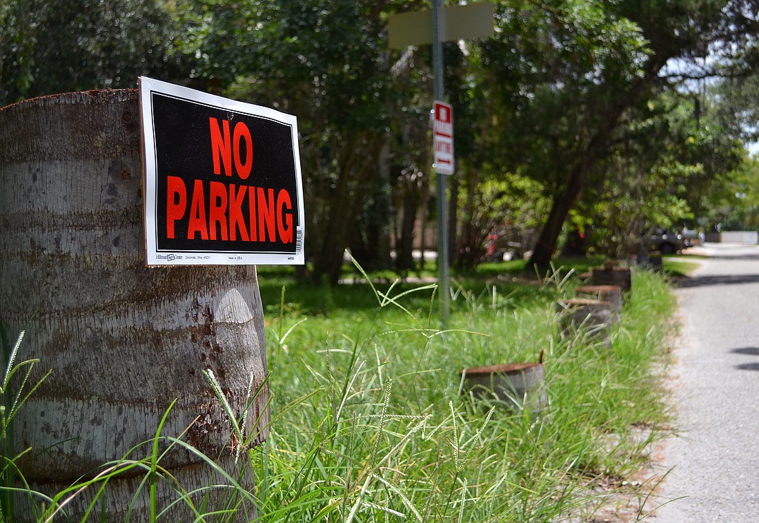 Photo by Jessica Salmond Some residents attempt to solve the problem by putting up no-parking signs.