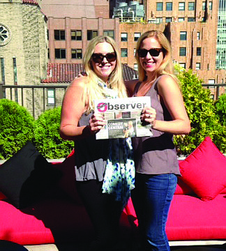 NEW HEIGHTS. Nikki Taylor and Jane Thompson took their most recent issue of the Sarasota Observer to the rooftop of the Kimberly Hotel in New York City.