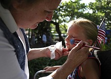 Karen Bell paints a patriotic picture on Anna Donnellanâ€™s face.