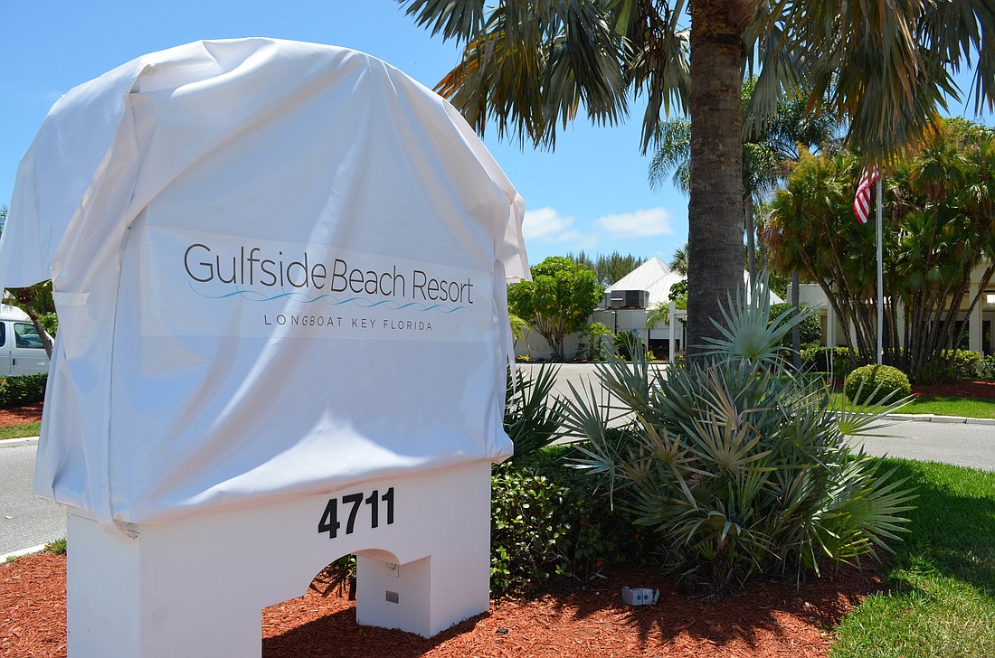 A white tarp was placed over the Hilton sign in June, dubbing the hotel property at 4711 Gulf of Mexico Drive as the Gulfside Beach Resort.