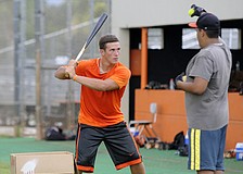 Sarasota High senior catcher Carson Keyser works on a hand-eye coordination drill during the Sailors baseball camp July 7.