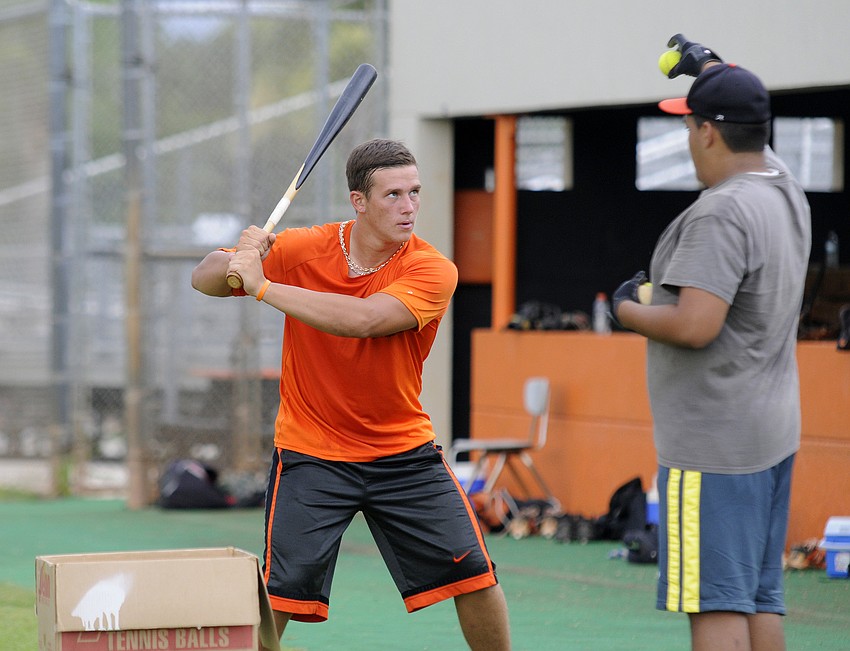 Sarasota High senior catcher Carson Keyser works on a hand-eye coordination drill during the Sailors baseball camp July 7.