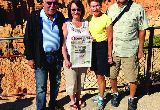 CANYON CRAWL. Ron and Glenda Robertson and Elaine and Pete Bokach brought their East County Observer to Bryce Canyon National Park, in Utah.