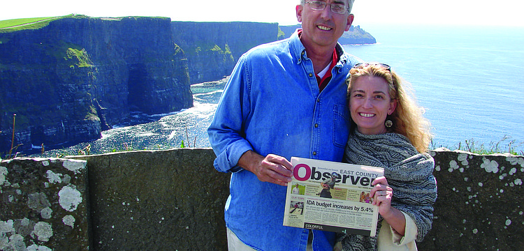 LOVELY TRIP. Peter and Christie Nolan recently got married in Ireland, and the couple stopped to catch up on their Observer news while honeymooning near the Cliffs of Moher.