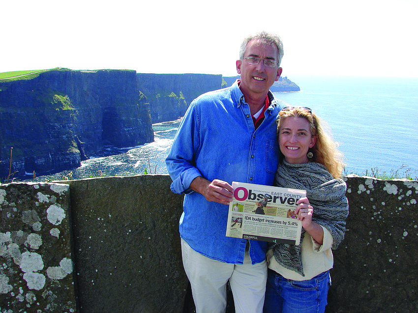 LOVELY TRIP. Peter and Christie Nolan recently got married in Ireland, and the couple stopped to catch up on their Observer news while honeymooning near the Cliffs of Moher.