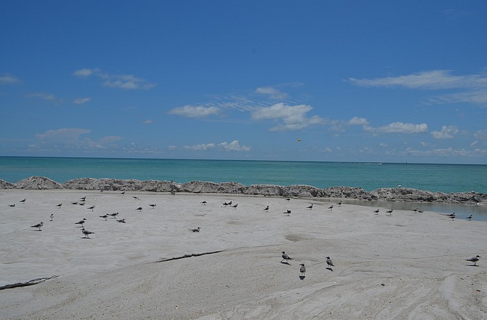 Sand stopped pumping onto the north end of the island July 3 and the contractor spent the last week smoothing out the sand and grooming the newly shaped coastline.
