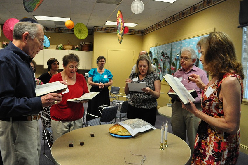 Attendees of the service say kiddish as they finish the Shabbat service.