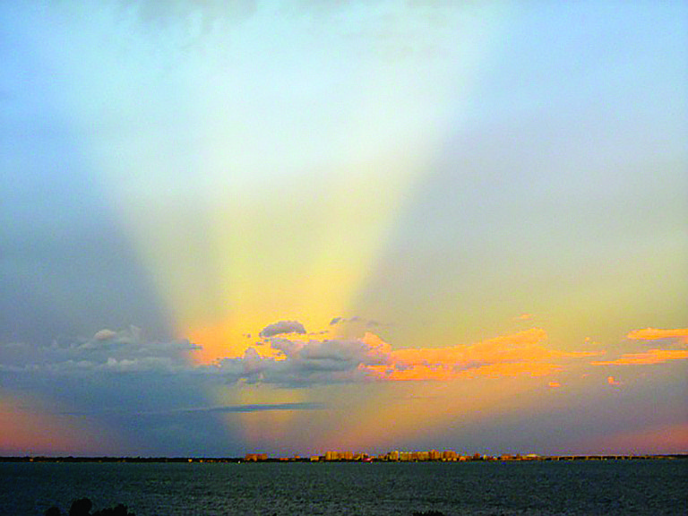 Robert Bernhard submitted this sunset photo of light emanating from the Sarasota skyline. The photo was taken from Grand Bay on Longboat Key.