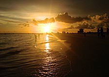 Storm clouds roll in as the sun sets on Lido Beach.