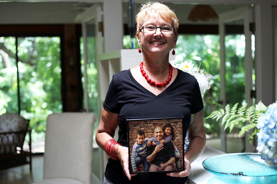 Esther Howard holds a photo of her son, Tim Howard, whose performance earned him acclaim at the 2014 FIFA World Cup.