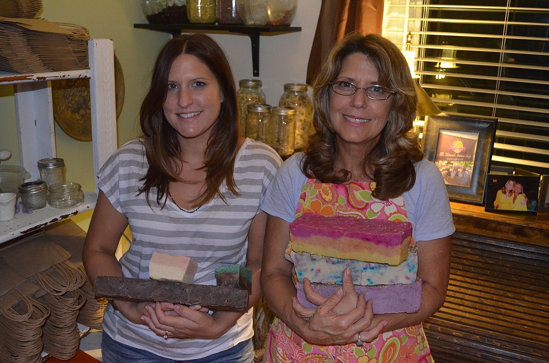 Ashley Baker and Joy Loos produce and package their soaps at home. Photo by Harriet Sokmensuer
