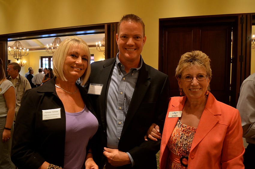 Pamela Yemma, Stephen Supe and Lori Denny wait for lunch and the presentation.