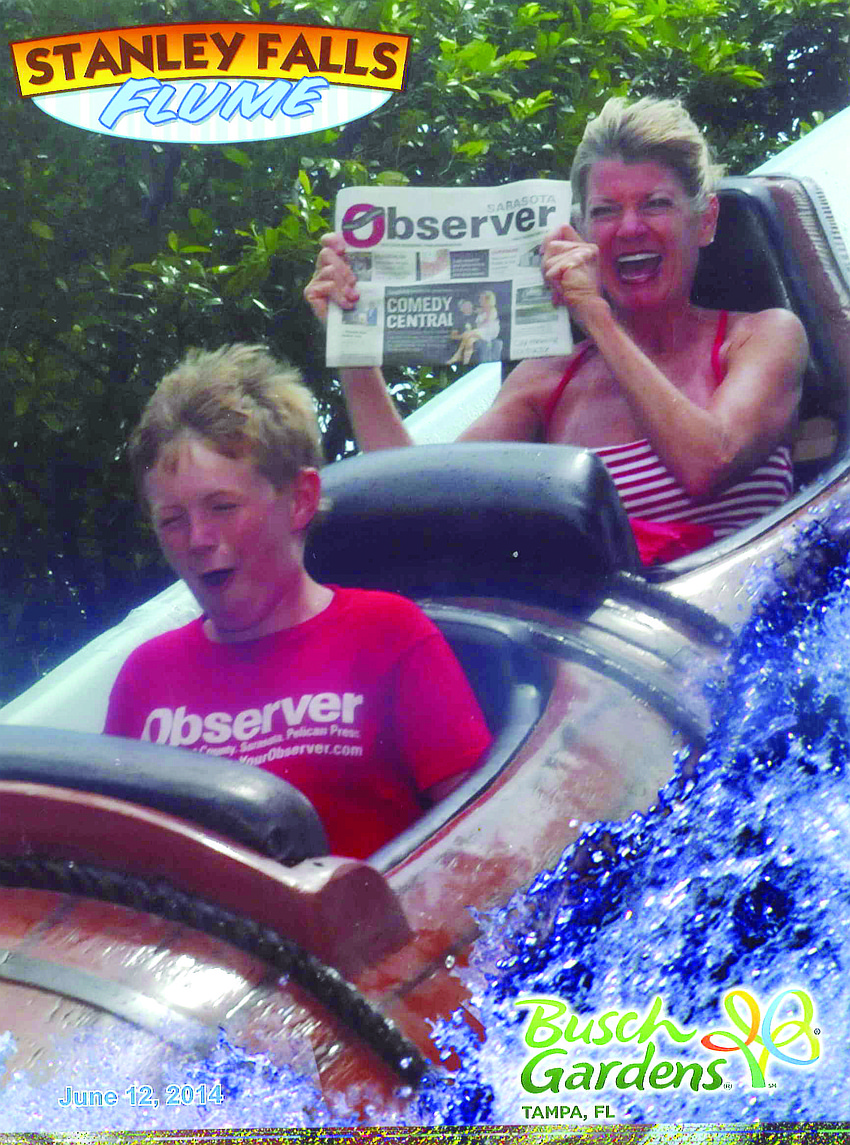 SPLISH SPLASH. Donna Condon and her son, Shepard, had a firm grip on their Observer while braving a 40-foot drop to the base of the roaring Stanley Falls at Busch Gardens in Tampa recently.