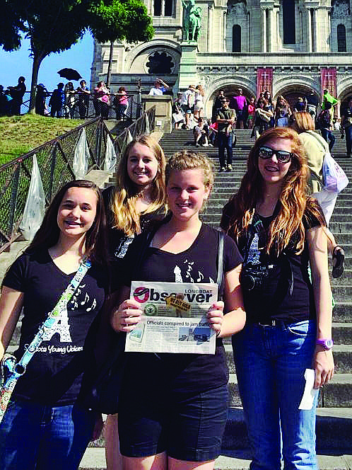 A STEP ABOVE. Gillian Gardner, Sarah Van Keuren, Angie Klosner and DeAnne Sipes of the Sarasota Young Voices traveled with their hometown newspaper to the steps of the Basilica of the Sacred Heart of Paris, where they performed an impromptu concert.