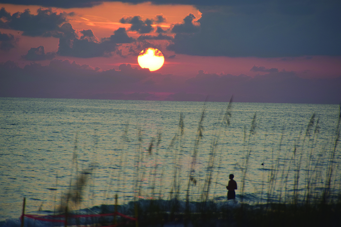 Madhav Mutalik submitted this photo of a boy fishing at sunset, taken on Longboat Key.