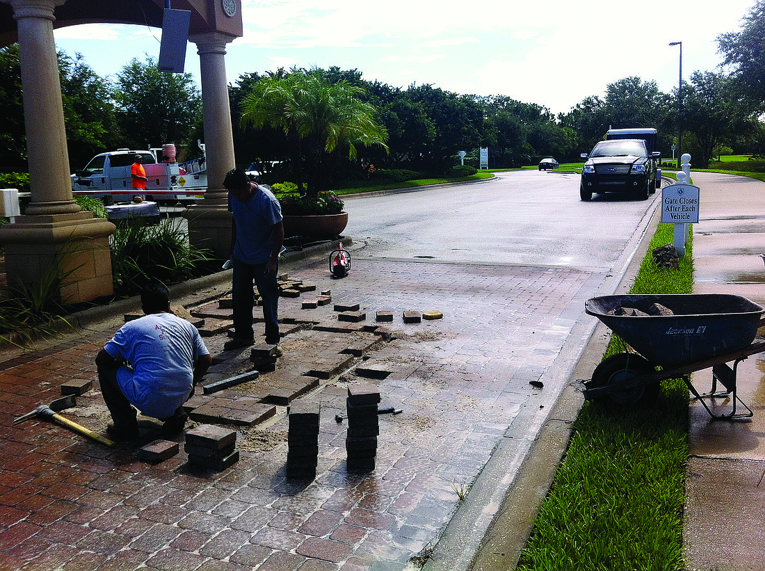 Courtesy photo Artistic Paver assists with installation of the project July 15 at the gate at Balmoral Woods and Lakewood Ranch boulevards.