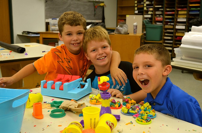 Grayson Meyer, Caleb Hebert and Landon Stewart make crafts.