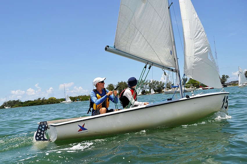Students adjust their sails as they catch wind in Sarasota Bay.