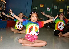 Sofia Flores leads the group in dance.