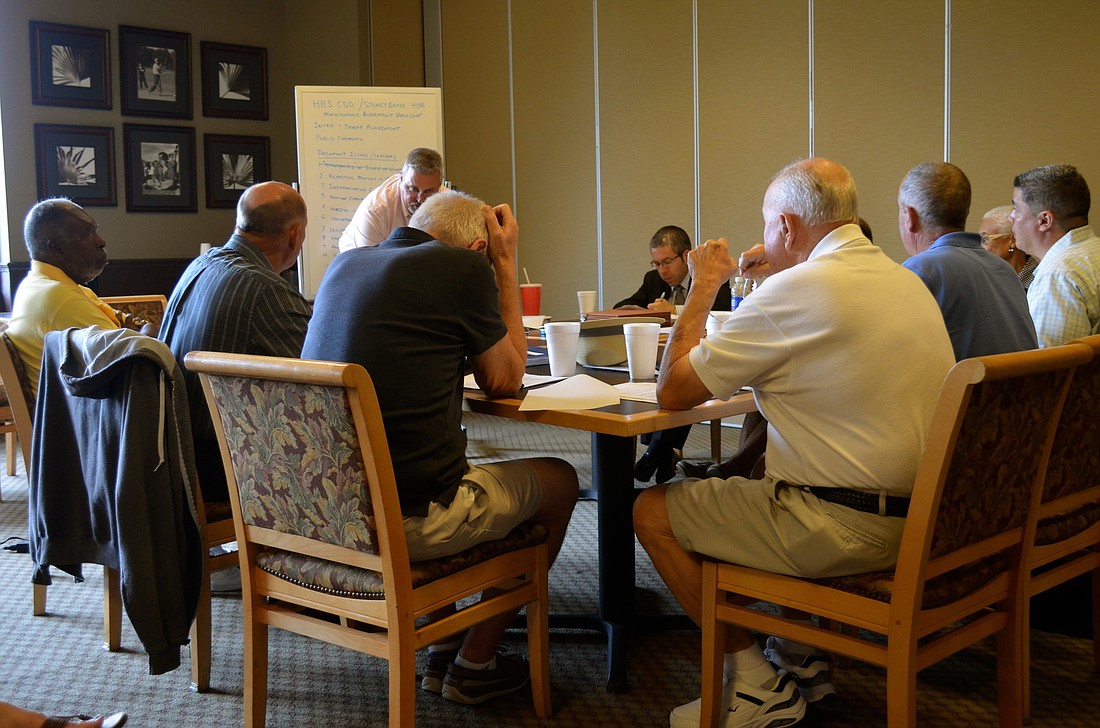 Members of the Heritage Harbour South CDD and Stoneybrook HOA met July 29 to discuss a landscape agreement.