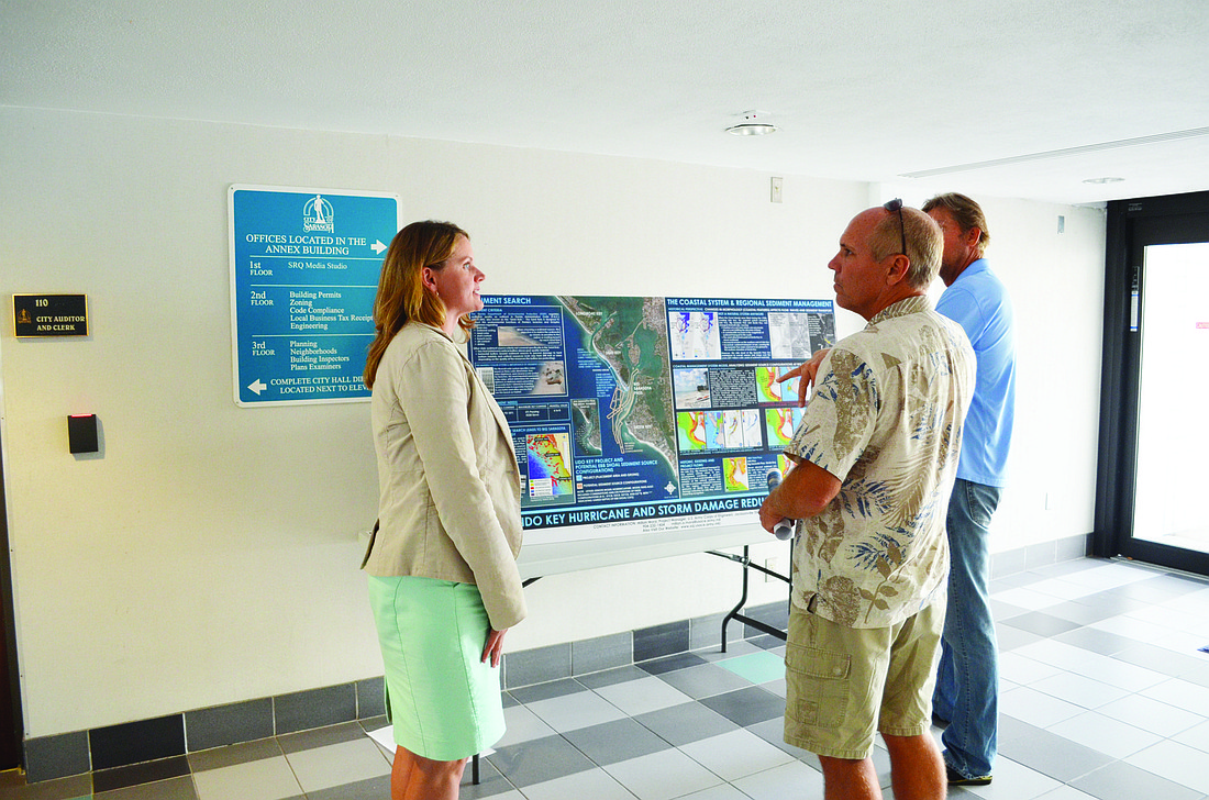 Photo by David Conway Army Corps officials explain in detail the findings of their report, which presents models that show the dredging of Big Pass would have negligible effects on Siesta Key.