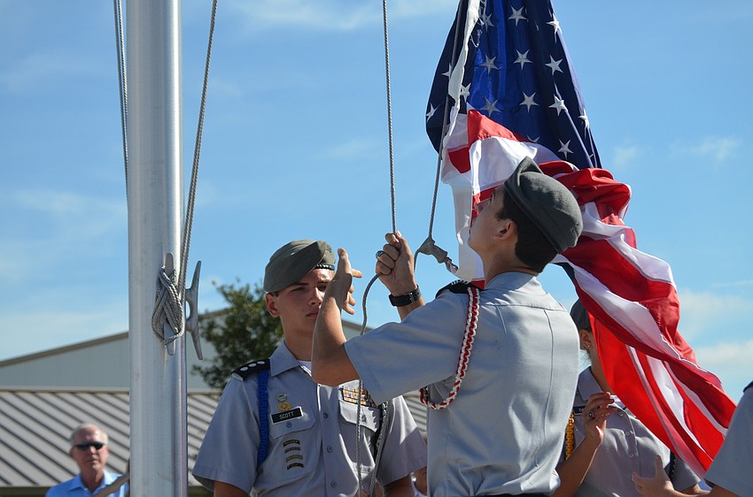 Cadets raise the flag.