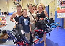 Kathy Akin, Connor Crandall, Carolyn Tudor and Tammy Swafford wait in line.