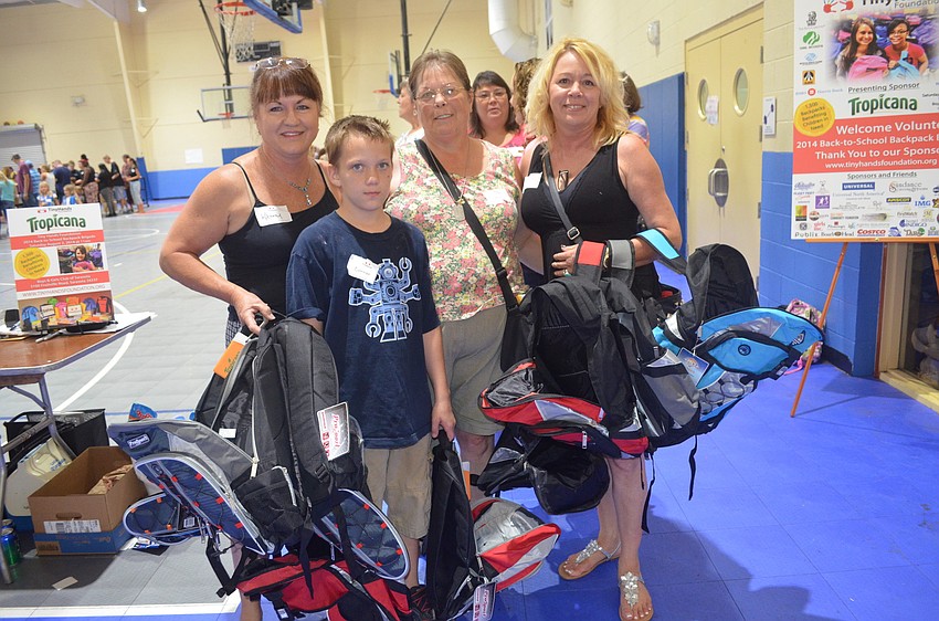 Kathy Akin, Connor Crandall, Carolyn Tudor and Tammy Swafford wait in line.
