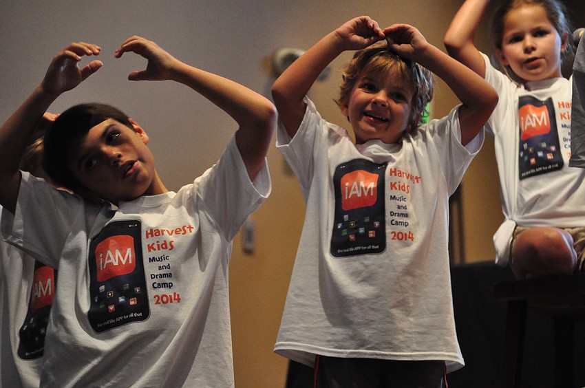 Corbin Merriott and Roman Haught remember all the actions for the songs.