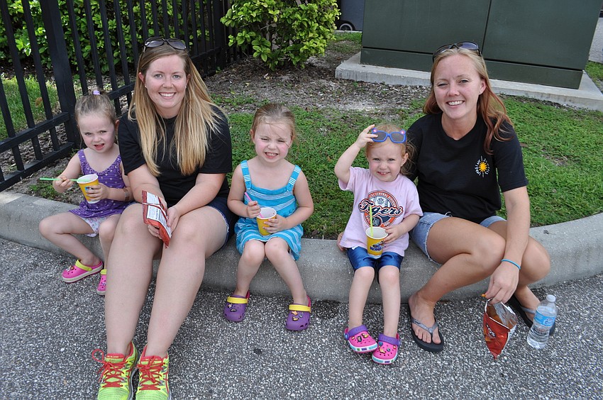 Alliejo Wolfinger sits with teacher Stephanie Mihlbauer and her siblings and mother, Serena, Cami and Christen Wolfinger.