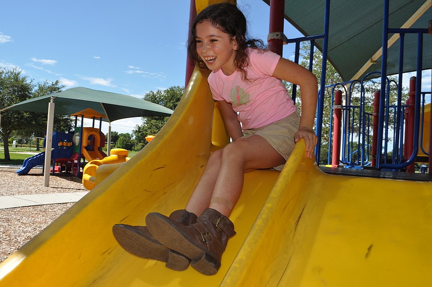 Macayla Yannucciello, 8, goes down the slide.
