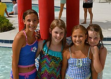 Sophia Warmbier, Amely Wackerbauer, Bella Warmbier and Kayla Wackerbauer cool off in the pool.