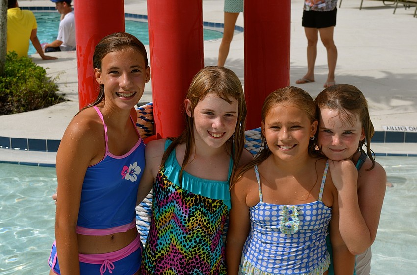 Sophia Warmbier, Amely Wackerbauer, Bella Warmbier and Kayla Wackerbauer cool off in the pool.