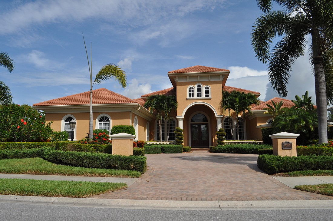 This Country Club Village at Lakewood Ranch home, which has three bedrooms, four-and-a-half baths, a pool and 5,008 square feet of living area, sold for $1,325,000. Photo by Pam Eubanks