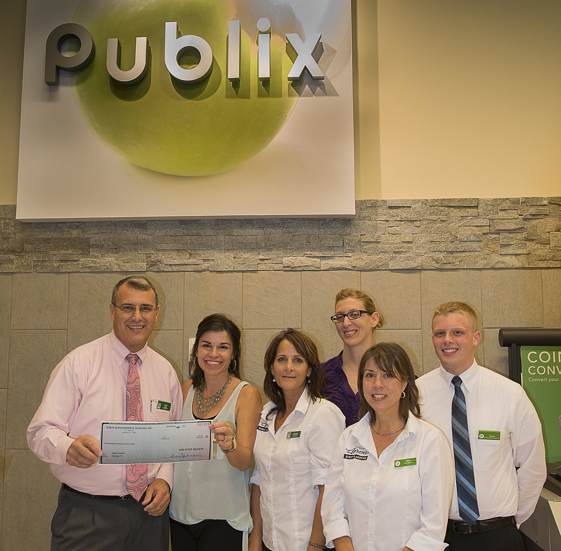 Publix Manager Andy Lappin and Selah Freedom President Elizabeth Fisher with Publix employees Michele Toussaint, Denise Rowland, Gina Fabrizio and Trevor Moore. Courtesy photo
