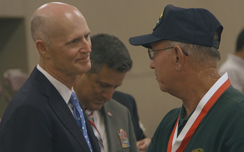 Gov. Rick Scott honors veterans with medals at the Sarasota National Guard Armory Tuesday.