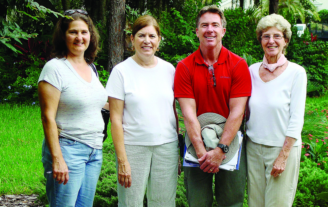 Manatee County Extension Agent Lisa Hickey, Henley resident Emily Vosnos, Ross Peterson and Polly Curran complete visits to homesites. Courtesy photo
