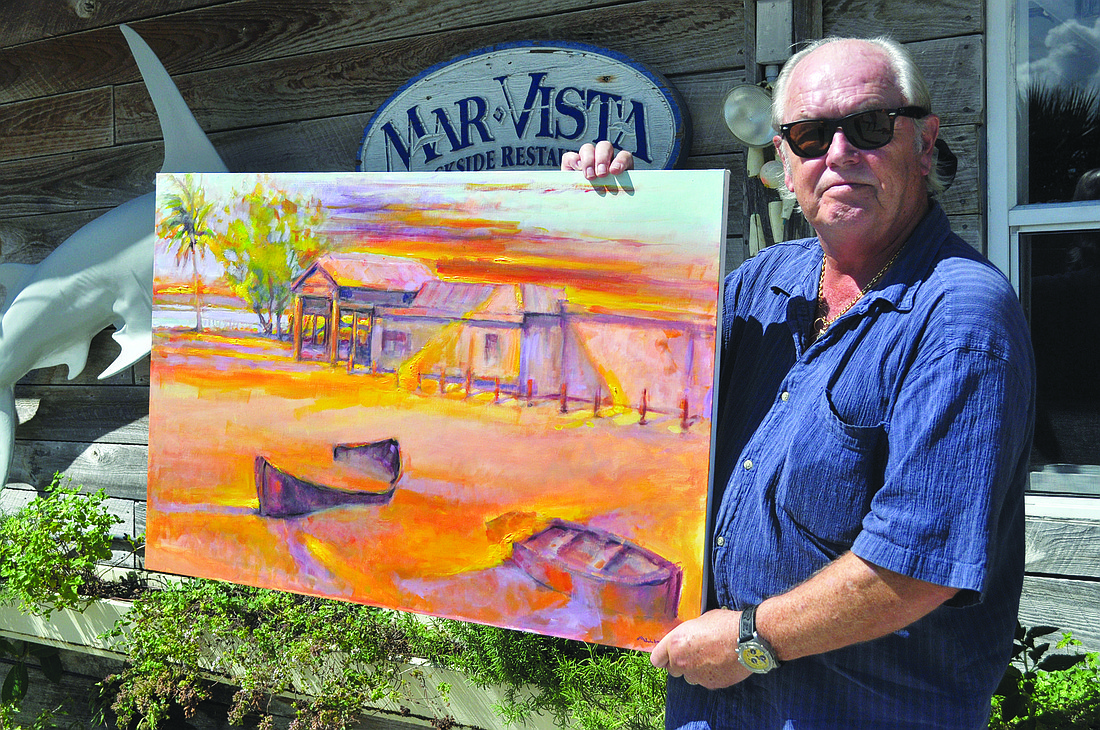 John Allinson poses with his painting of Mar Vista Dockside Restaurant & Pub. Photos by Heather Merriman
