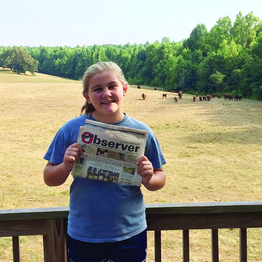 MAGICAL TRIP. Averie Robinson brought along her Longboat Observer to Magic R Farm in St. Charles, Ky.