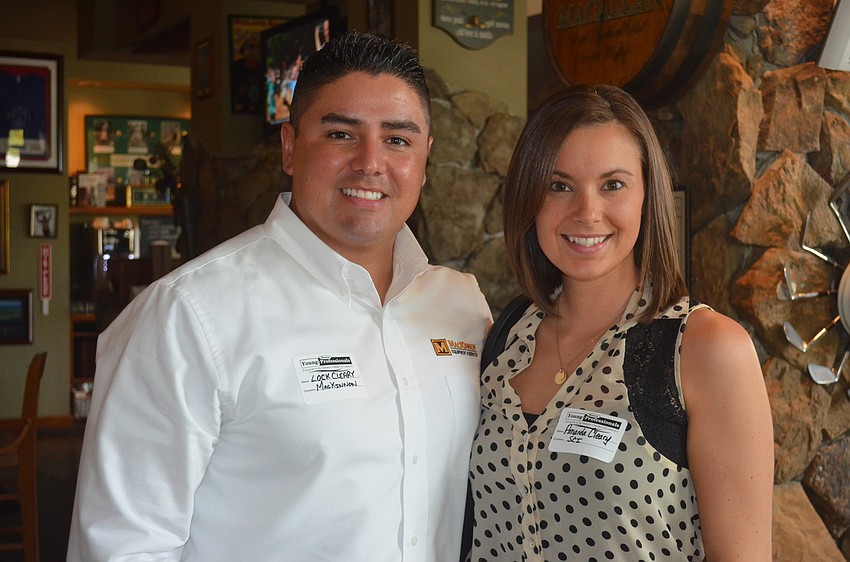 Husband and wife professionals Lock and Amanda Cleary network with new friends.